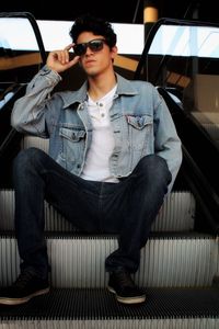 Young man sitting on sofa