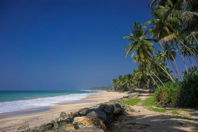 Scenic view of sea against clear blue sky