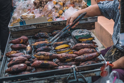 Man preparing food for sale at market