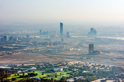 High angle view of buildings in city against sky