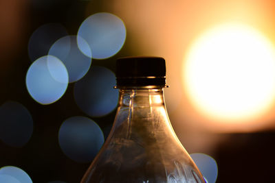 Close-up of glass bottle on table