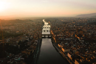 High angle view of city buildings during sunset