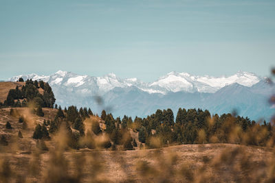 Scenic view of snowcapped mountains against sky