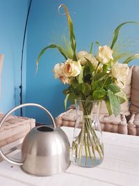 Close-up of white flowers in vase on table