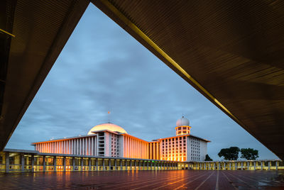 View of bridge and buildings against sky