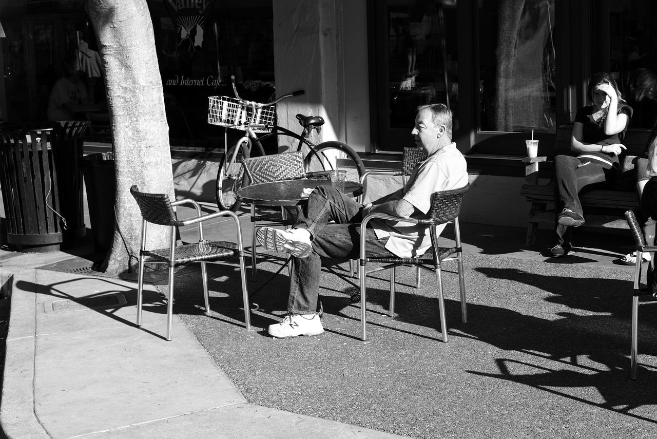 large group of objects, chair, retail, street, building exterior, market, built structure, market stall, architecture, for sale, in a row, abundance, arrangement, outdoors, day, sidewalk, empty, stack, incidental people, store