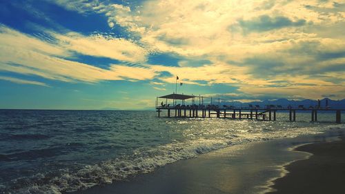 Scenic view of sea against cloudy sky