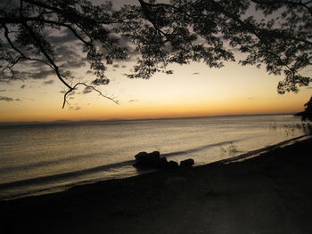 Scenic view of sea against sky at sunset