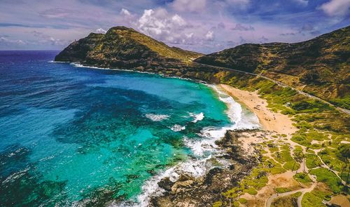 Scenic view of sea against cloudy sky