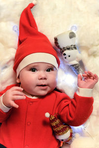 Portrait of cute baby girl with toy