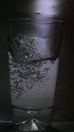Close-up of ice on glass table