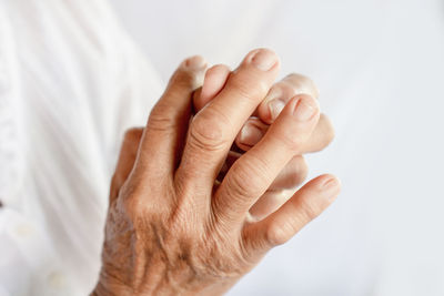 Close-up of woman hand on white background