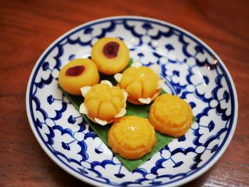 High angle view of fruits in plate on table
