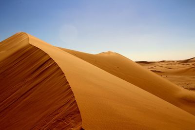 Low angle view of sand dune