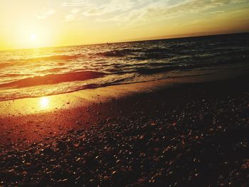 Scenic view of sea at sunset