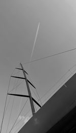 Low angle view of cables against clear sky