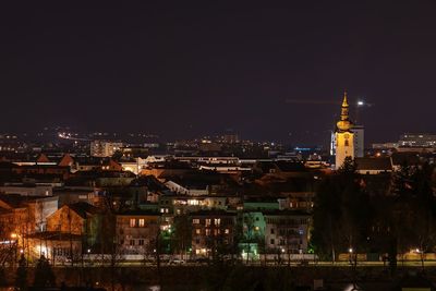 Illuminated buildings in city at night