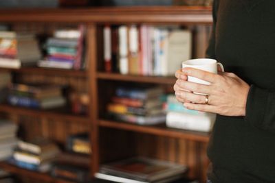 Woman holding coffee cup