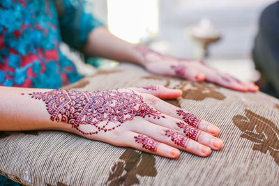 Close-up of woman holding hands