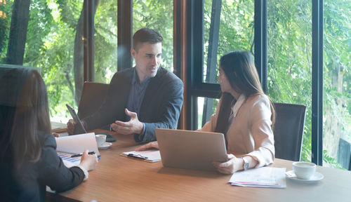 Group of people working on table