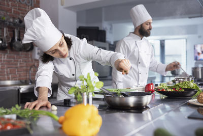 Portrait of senior man preparing food at home