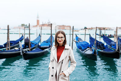 Portrait of smiling woman in boat at canal