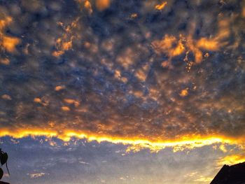 Low angle view of dramatic sky at sunset