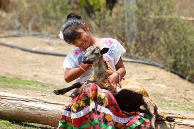 Rear view of girl and dog