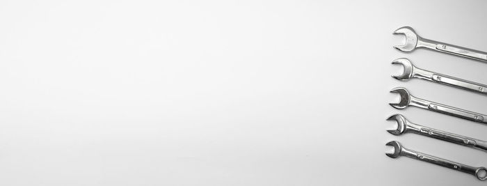 High angle view of screws over white background