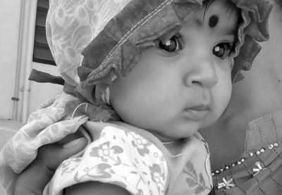 Close-up of cute baby at home