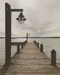 Pier over sea against sky