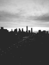 Cityscape against cloudy sky