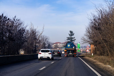 Cars on road against sky