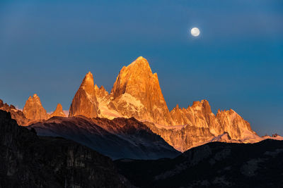 Scenic view of mountains against clear sky at night