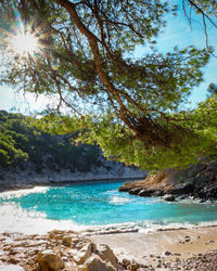 Scenic view of sea against sky on sunny day