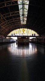 Illuminated railroad station in city