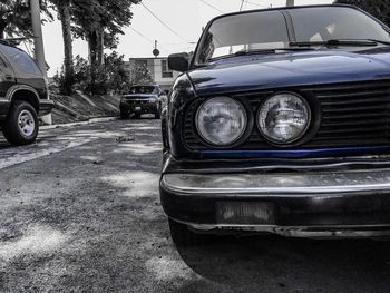 Vintage car parked on road against sky