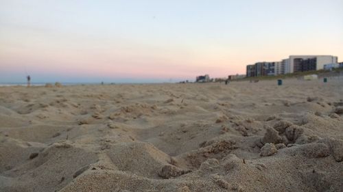 Scenic view of beach against sky during sunset