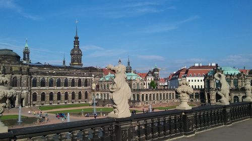 Buildings in city against sky