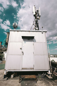 Low angle view of floodlight against sky