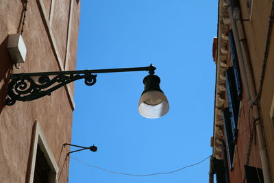 Low angle view of street light against clear sky