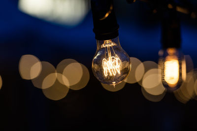 Close-up of illuminated light bulb