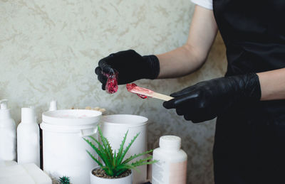 Midsection of woman holding ice cream