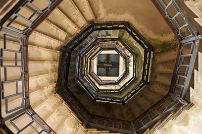 Low angle view of spiral staircase in building