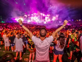 Group of people enjoying at music concert