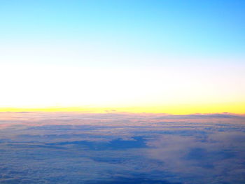 Scenic view of landscape against sky at sunset