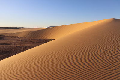 Scenic view of desert against clear sky