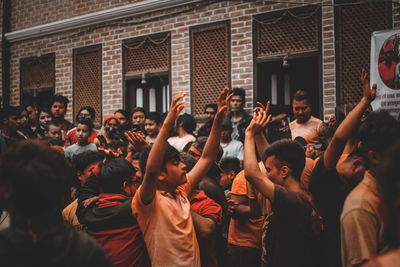 Group of people in front of building