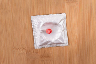 Directly above shot of white cake on wooden table