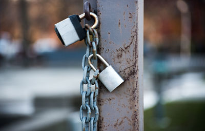 Close-up of padlocks on metal chain